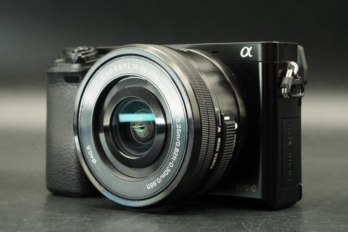 Sony a6000 Digital Mirrorless Camera Black w/ 16-50 + 55-210mm -24585 cut #12012