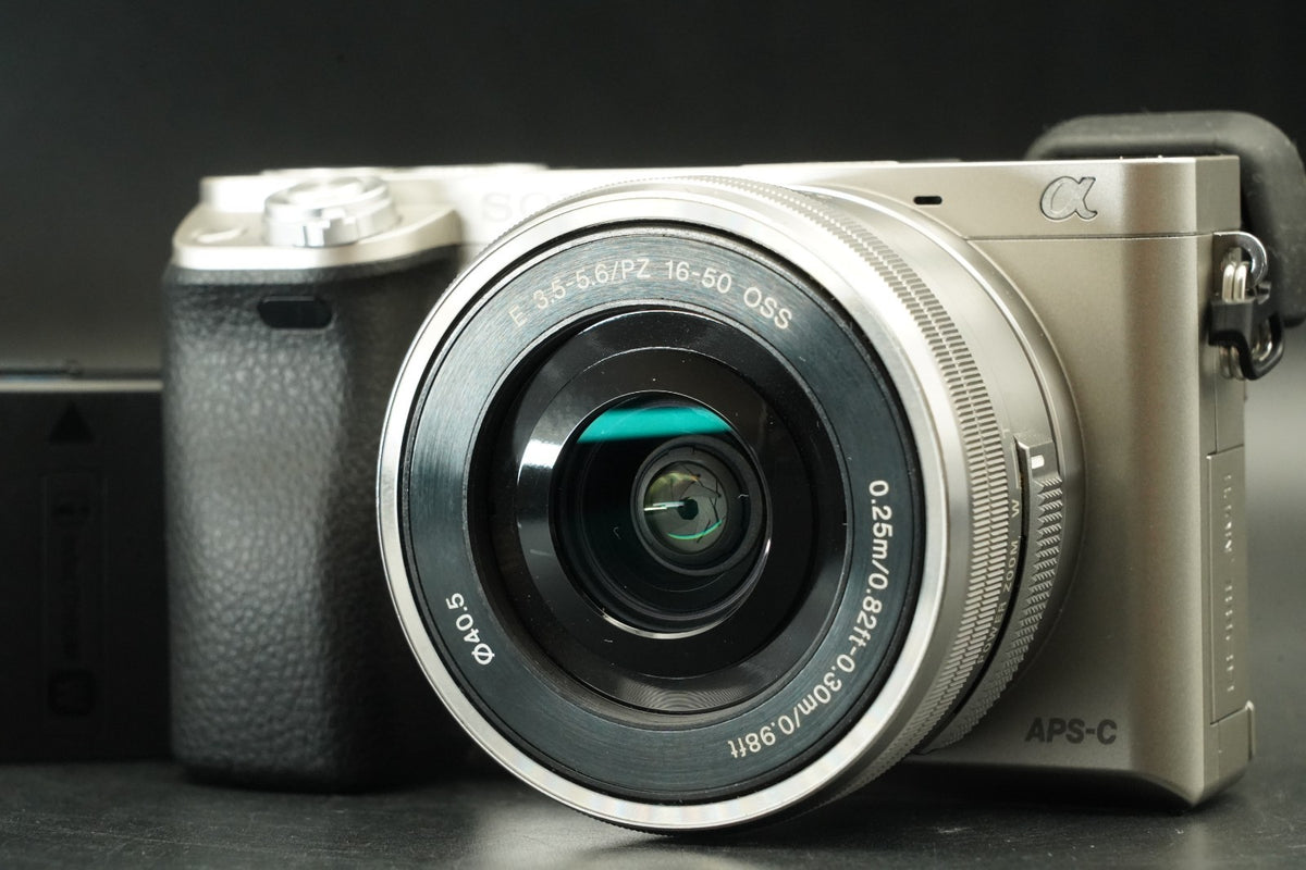 Sony a6000 Digital Mirrorless Camera Silver w/ 16-50mm Lens -778 cut- #12533