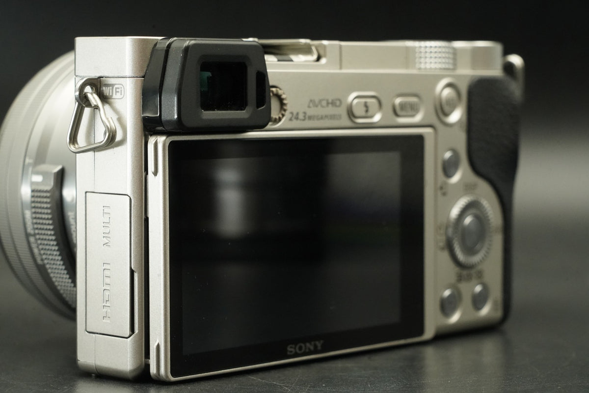 Sony a6000 Digital Mirrorless Camera Silver w/ 16-50 + 55-210mm -959 cut #12175