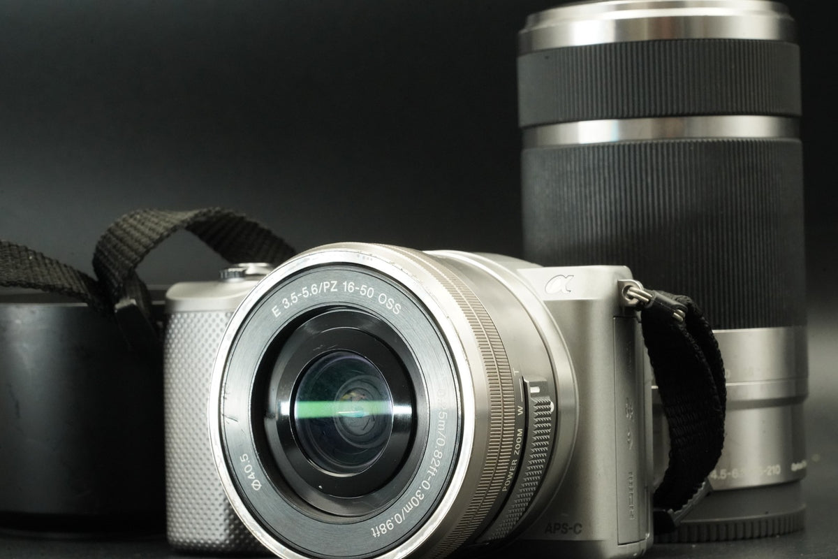 Sony a5000 Digital Camera Silver w/ 16-50 + 55-210mm -1277 cut US STOCK #12029