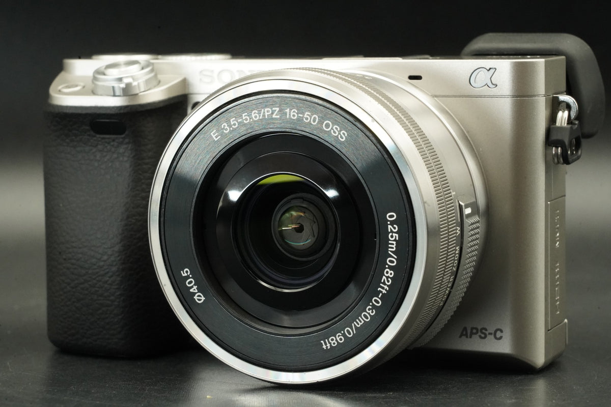 Sony a6000 Digital Mirrorless Camera Silver w/ 16-50mm Lens -3320 cut- #12564