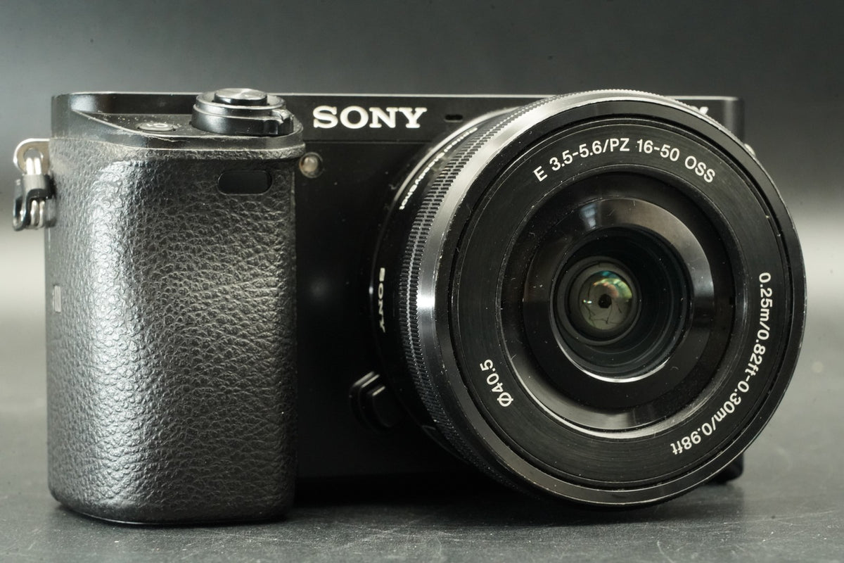 Sony a6000 Digital Mirrorless Camera Black w/ 16-50 + 55-210mm -24585 cut #12012