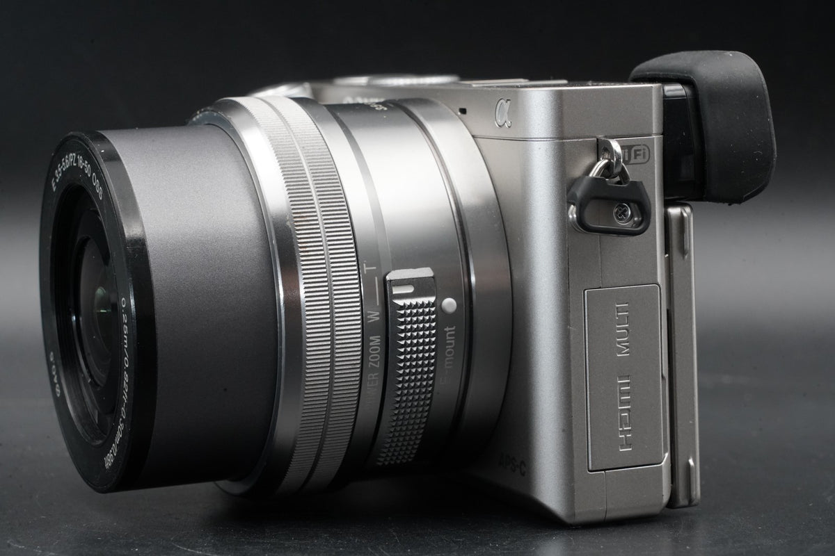 Sony a6000 Digital Mirrorless Camera Silver w/ 16-50 + 55-210mm -8463 cut #12193