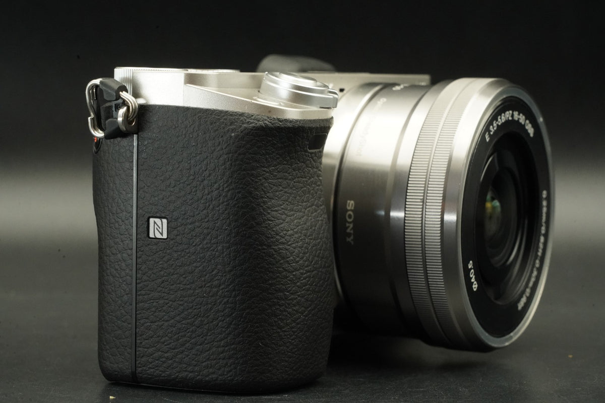 Sony a6000 Digital Mirrorless Camera Silver w/ 16-50mm Lens -3320 cut- #12564