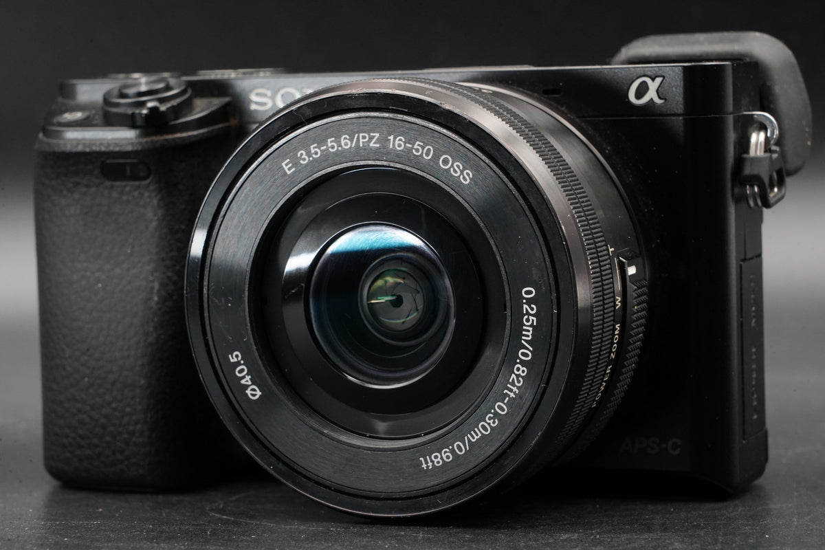 Sony alpha a6000 Digital Mirrorless Camera with Lens Black -75302 cuts- #11206