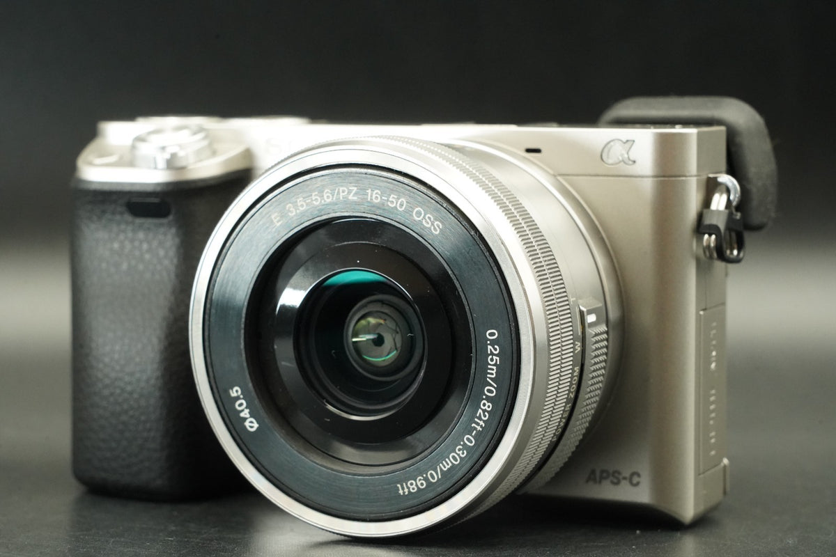 Sony a6000 Digital Mirrorless Camera Silver w/ 16-50mm Lens -778 cut- #12533