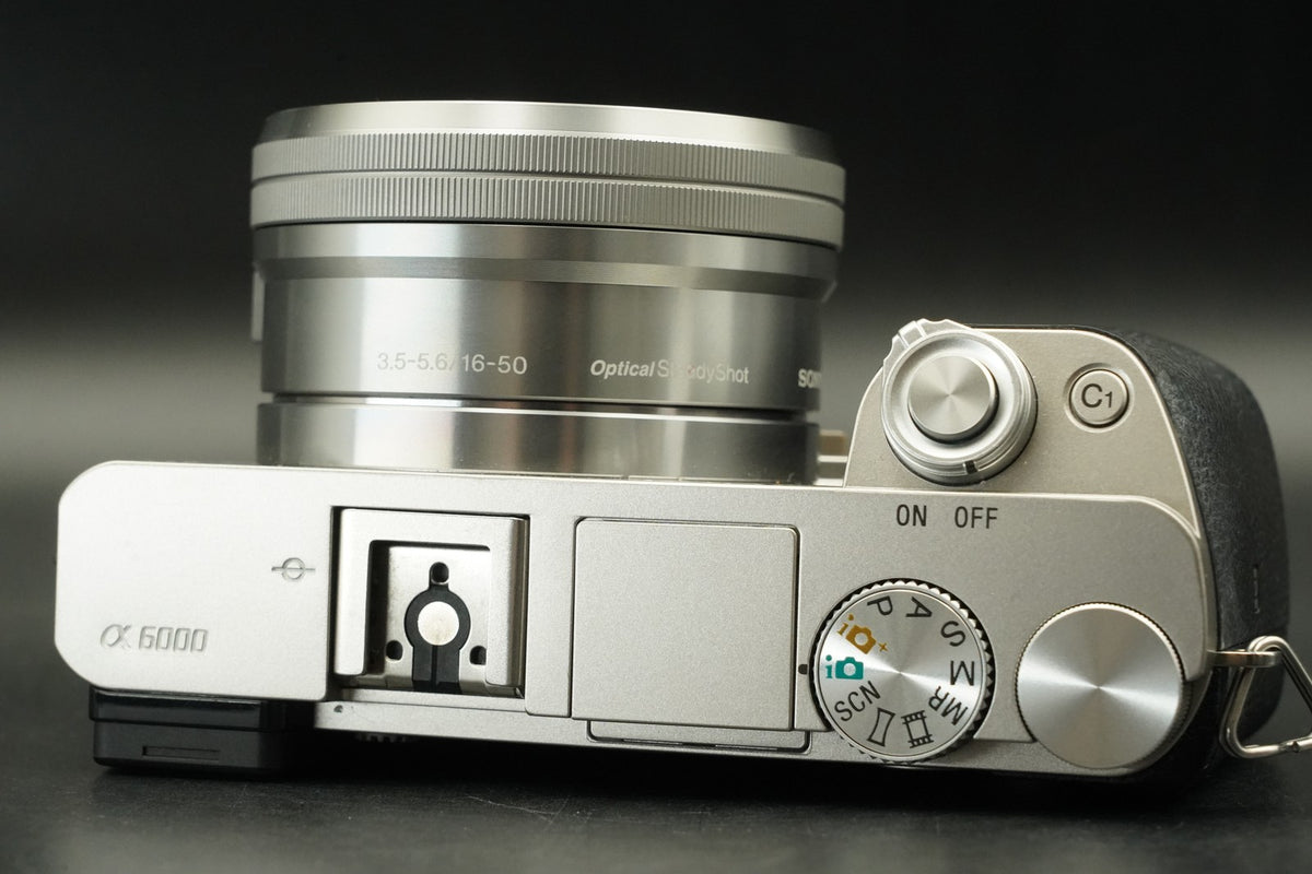 Sony a6000 Digital Mirrorless Camera Silver w/ 16-50 + 55-210mm -959 cut #12175