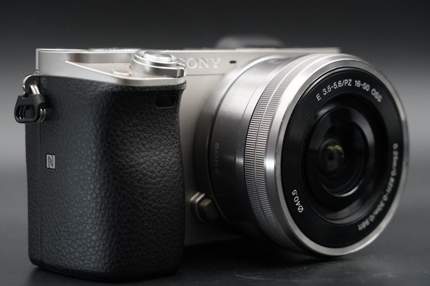 3411 cuts! Sony a6000 Digital Mirrorless Camera Silver w/ 16-50 + 55-210mm 10371