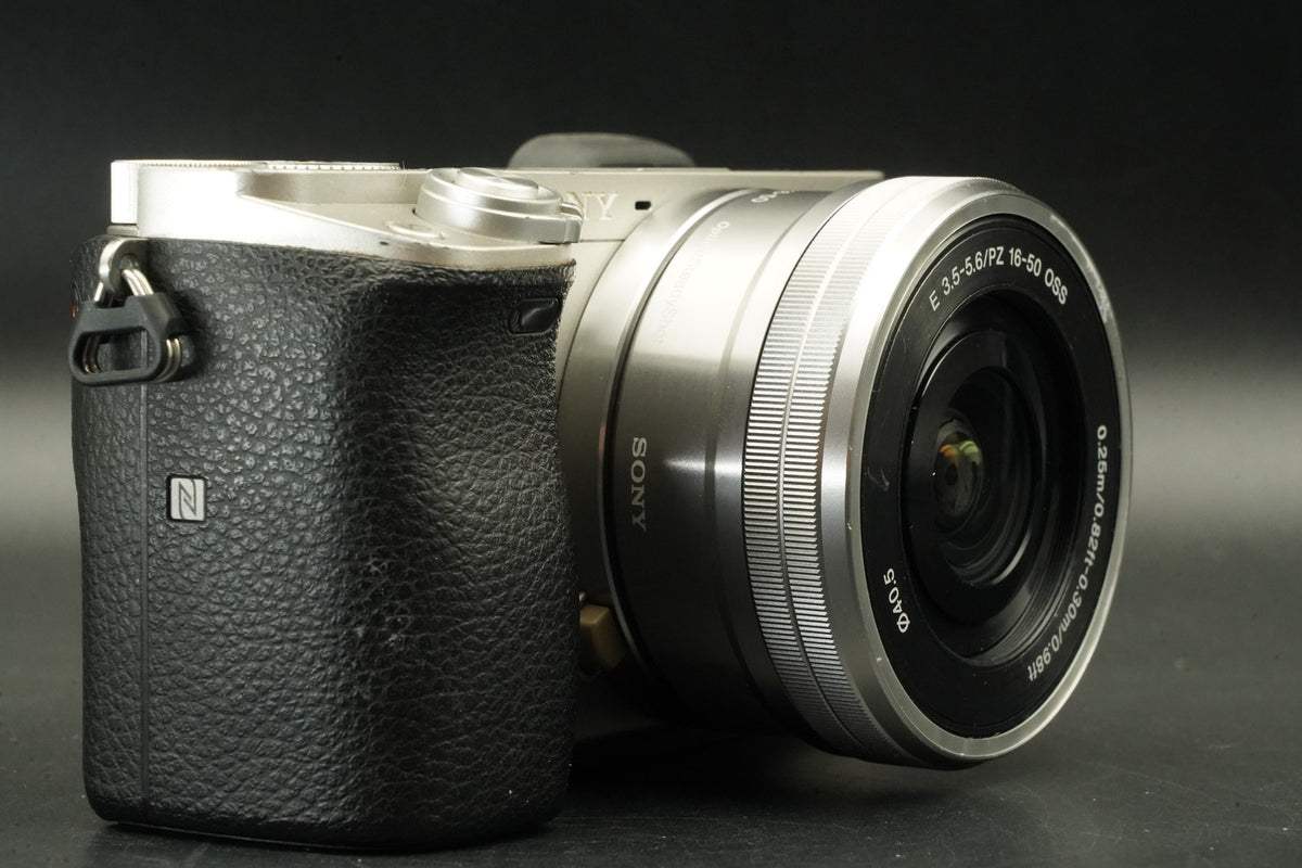 Sony a6000 Digital Camera Silver w/ 16-50 + 55-210mm -9333 cut- #12447