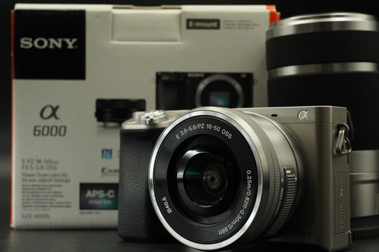 Sony a6000 Digital Mirrorless Camera Silver w/ 16-50 + 55-210mm -959 cut #12175