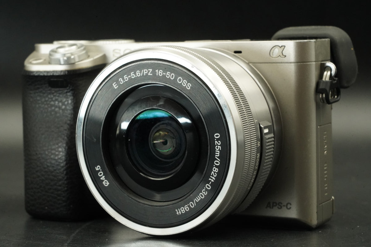 Sony a6000 Digital Camera Silver w/ 16-50 + 55-210mm -9333 cut- #12447